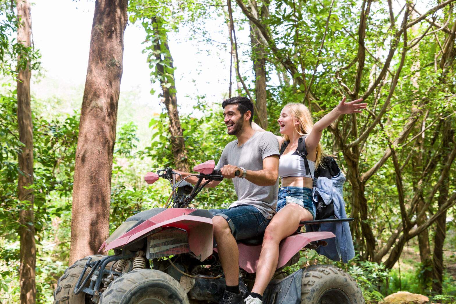Young,Man,And,Woman,Driving,Off,Road,Adventure,With,Happy